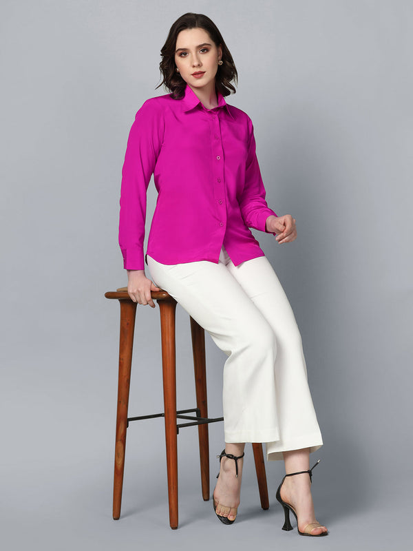 Collared crepe shirt in vibrant pink, styled with white trousers.