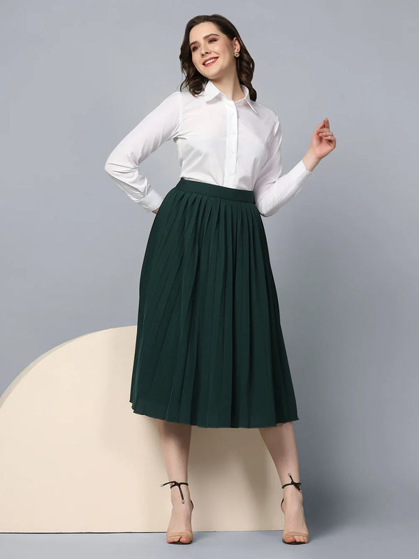 Pleated green skirt paired with a white collared crepe shirt.