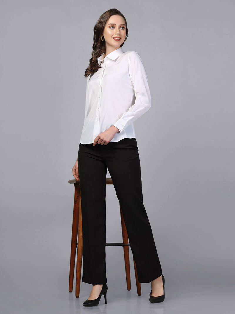 Collared white crepe shirt styled with black trousers and heels.