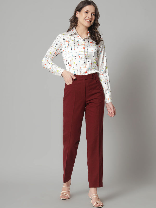 Printed collared shirt in white with colorful pattern, stylish outfit choice.