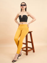 Women's slim fit stretch trousers in vibrant mustard yellow.