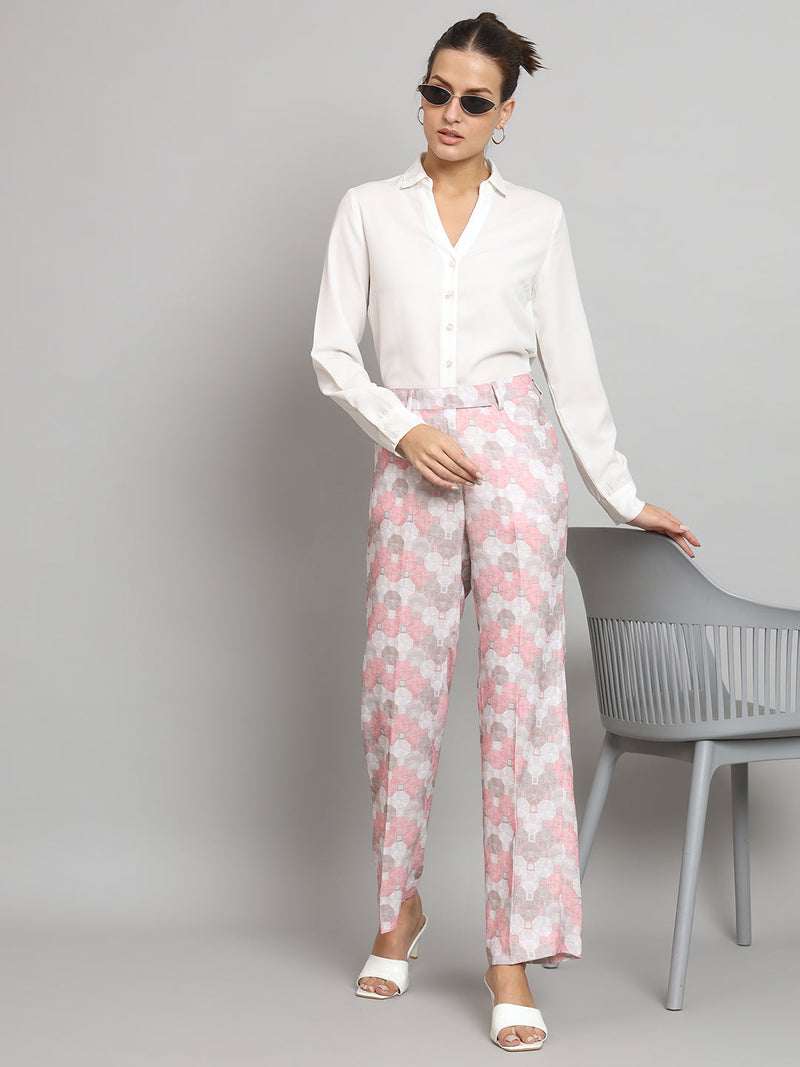 Mid waist pink printed straight fit trouser styled with a white shirt.