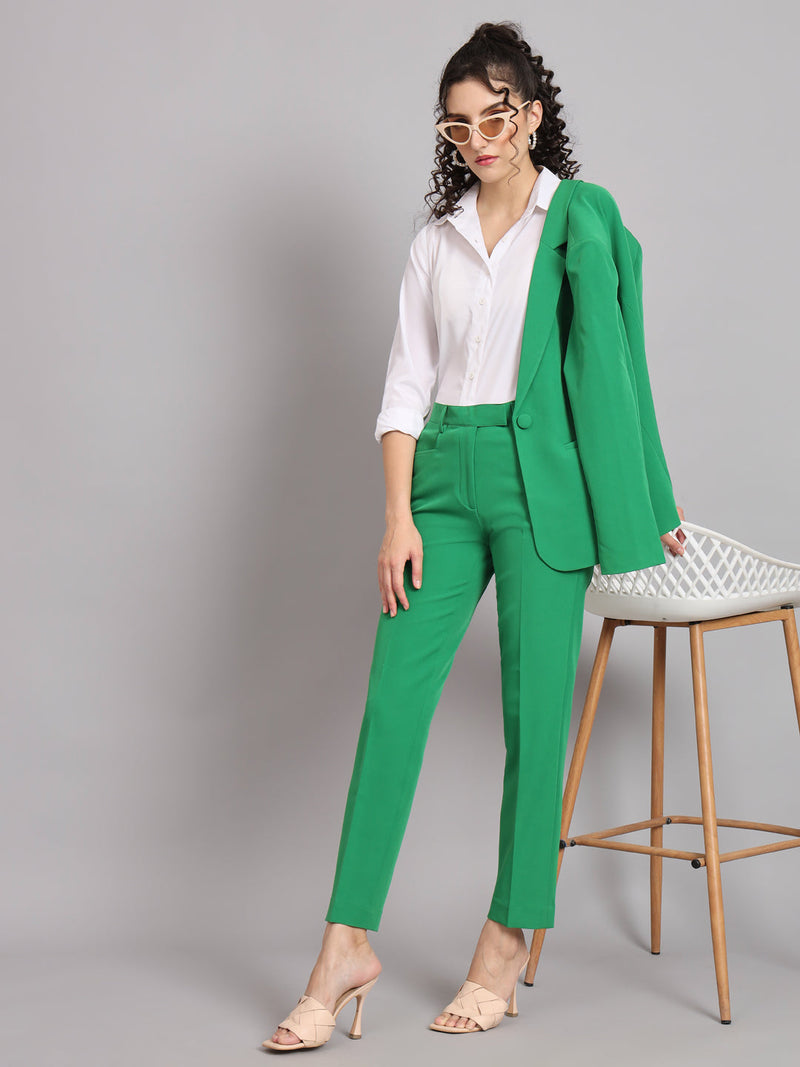 Regular fit mid waist parrot green trousers styled with a white shirt.