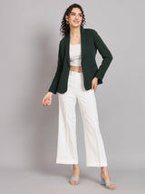 Notched collar polyester blazer in bottle green, styled with white pants.