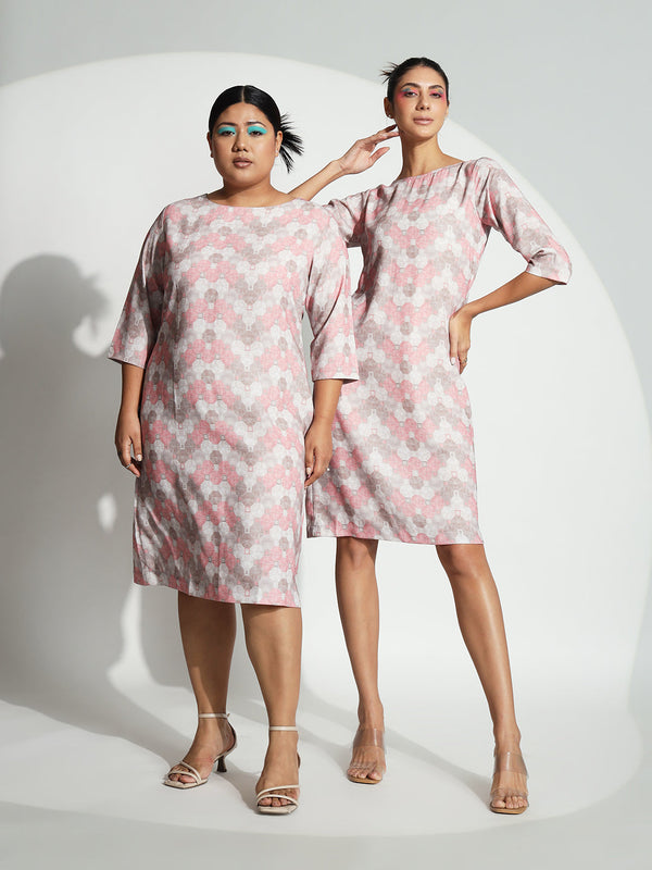 Printed sheath dress in pink worn by two models.