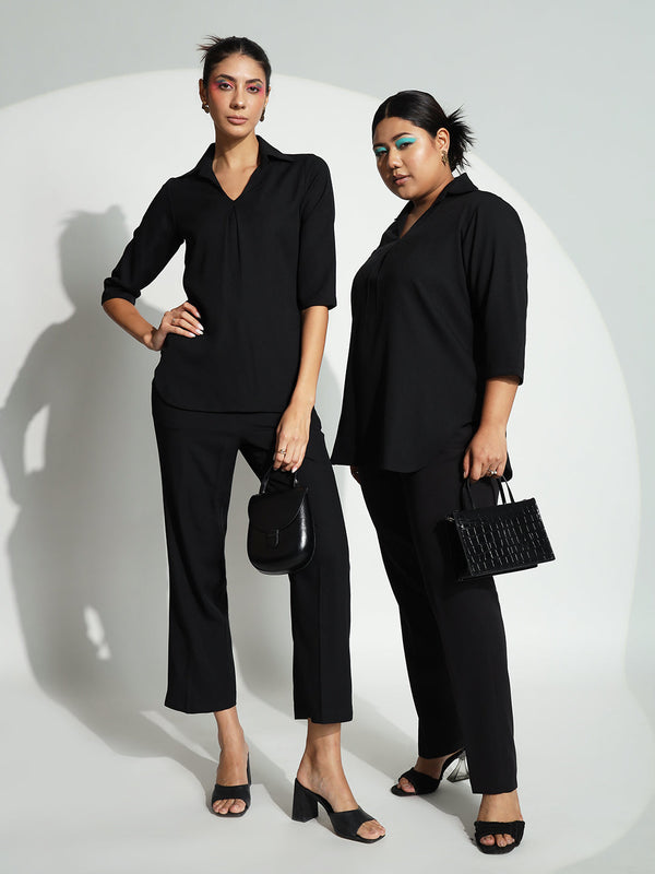 V-Neck shirt collar and box pleat pant suit in black.