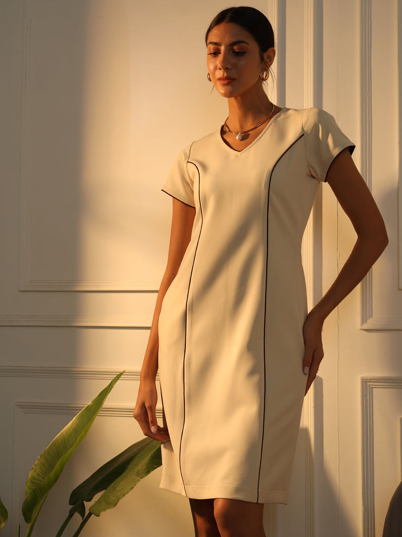 Piping detailed off-white dress, elegant women's fashion outfit.