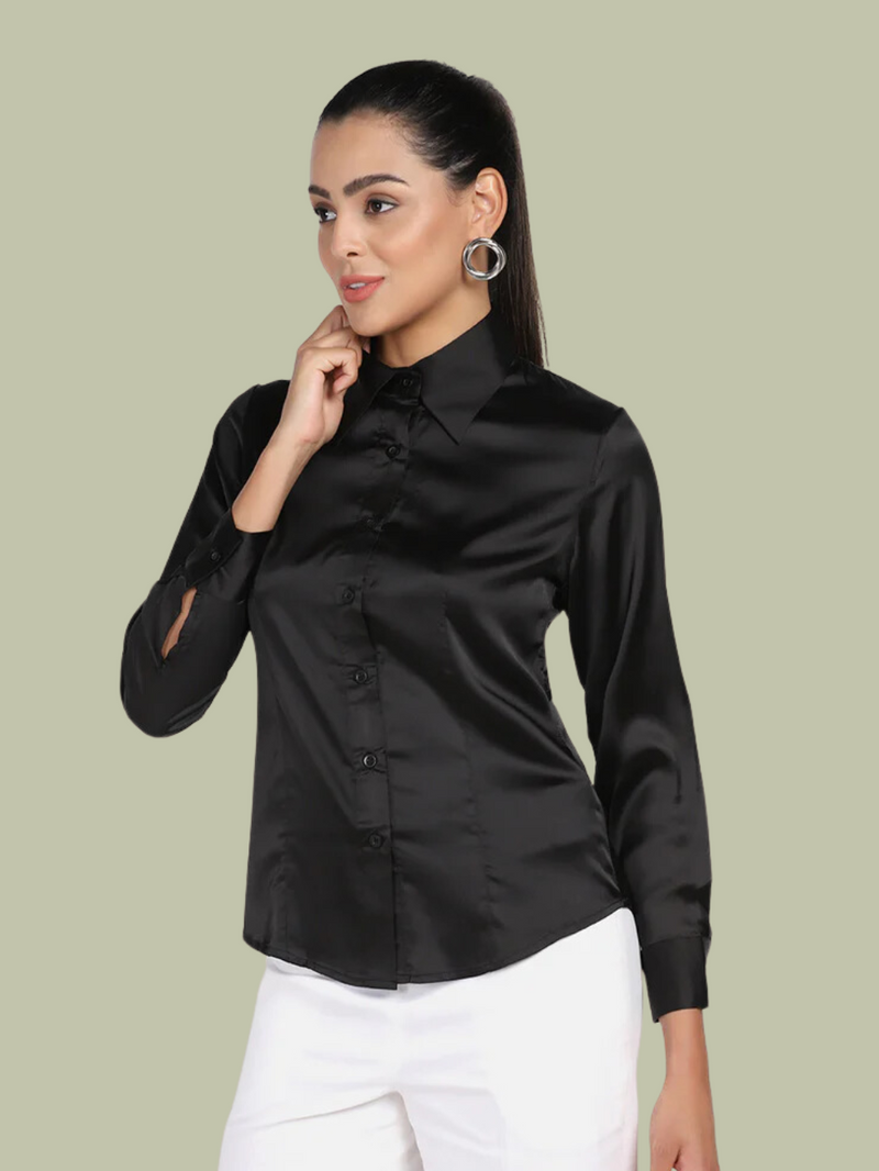 Elegant woman wearing a black satin stretch shirt, smiling.