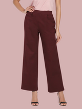 Wide bottom mid waist stretch pants in burgundy color.