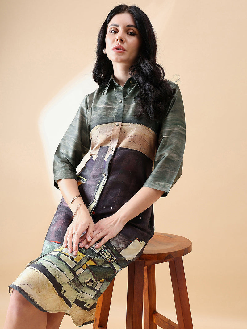 Model wearing a green printed shirt dress against a neutral background.