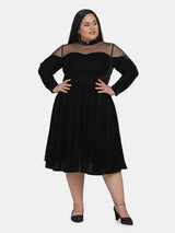 Elegant black velvet party dress with illusion neckline for women.