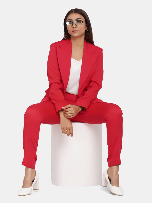 Single button red blazer for women styled with white top and heels.