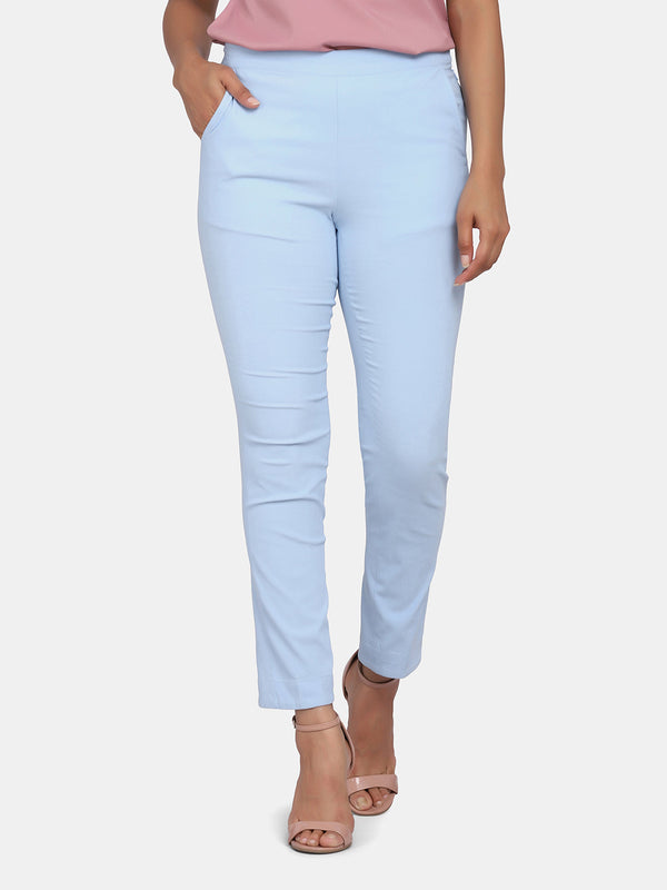 Women's slim fit trousers in sky blue for stylish outfits.