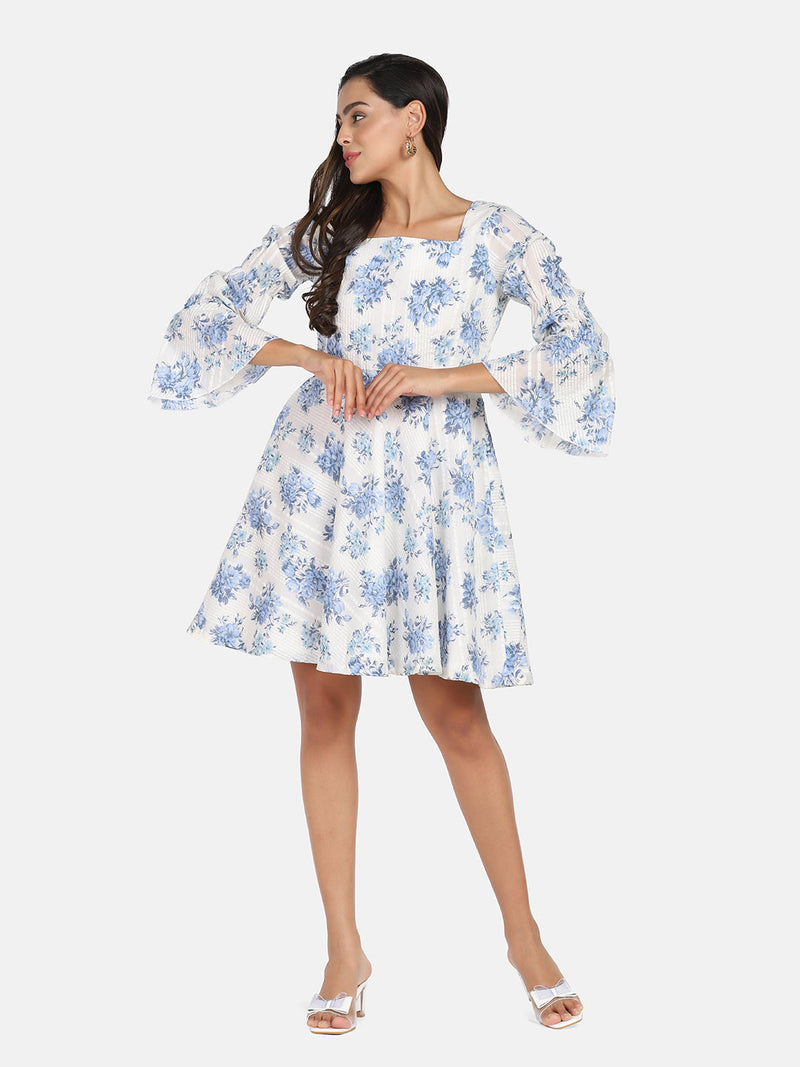 Cotton mini flare dress in blue and white floral design.