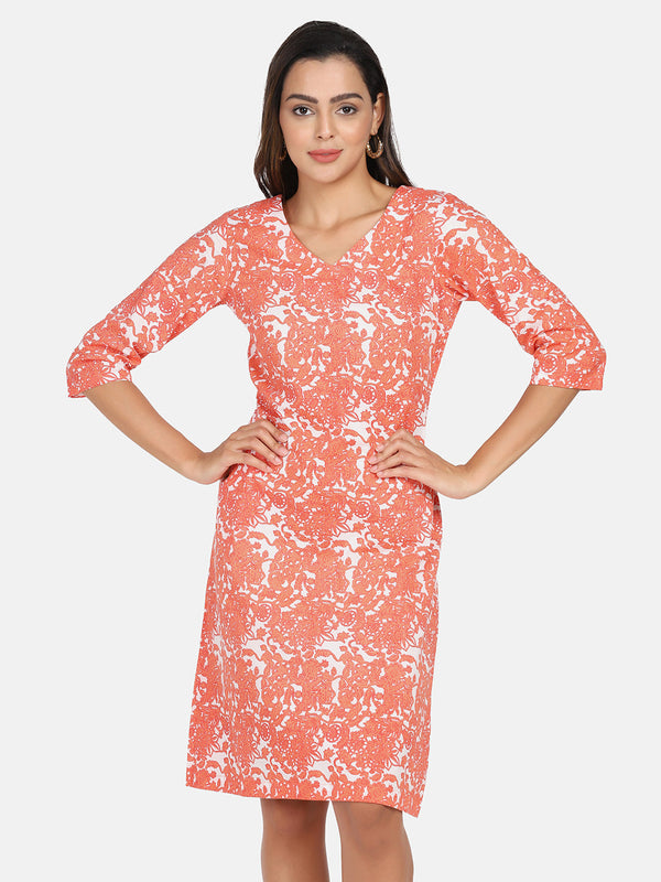 Cotton printed A-line dress in orange and white floral design.