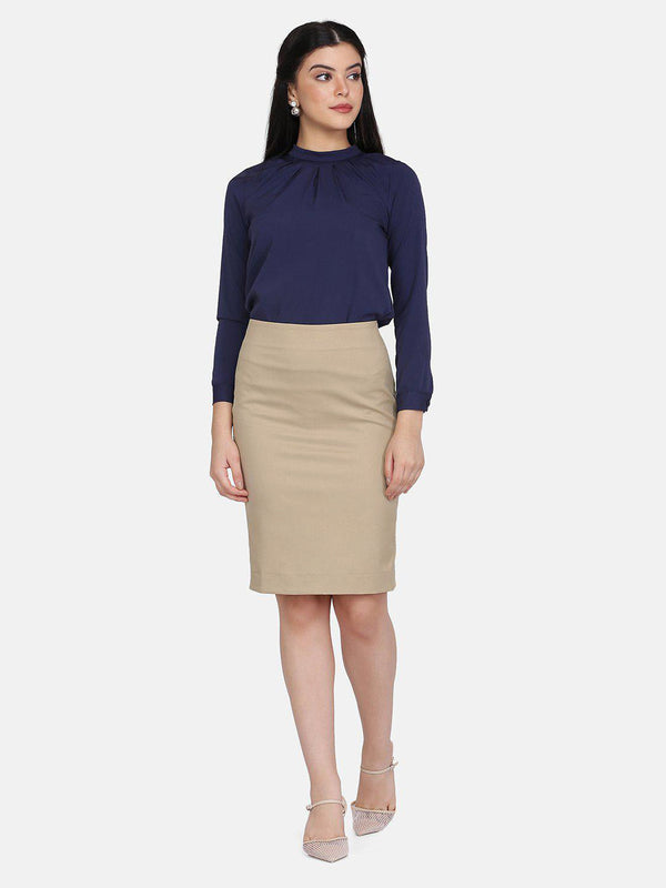 Straight skirt in Hazel Wood Beige styled with a navy blouse.