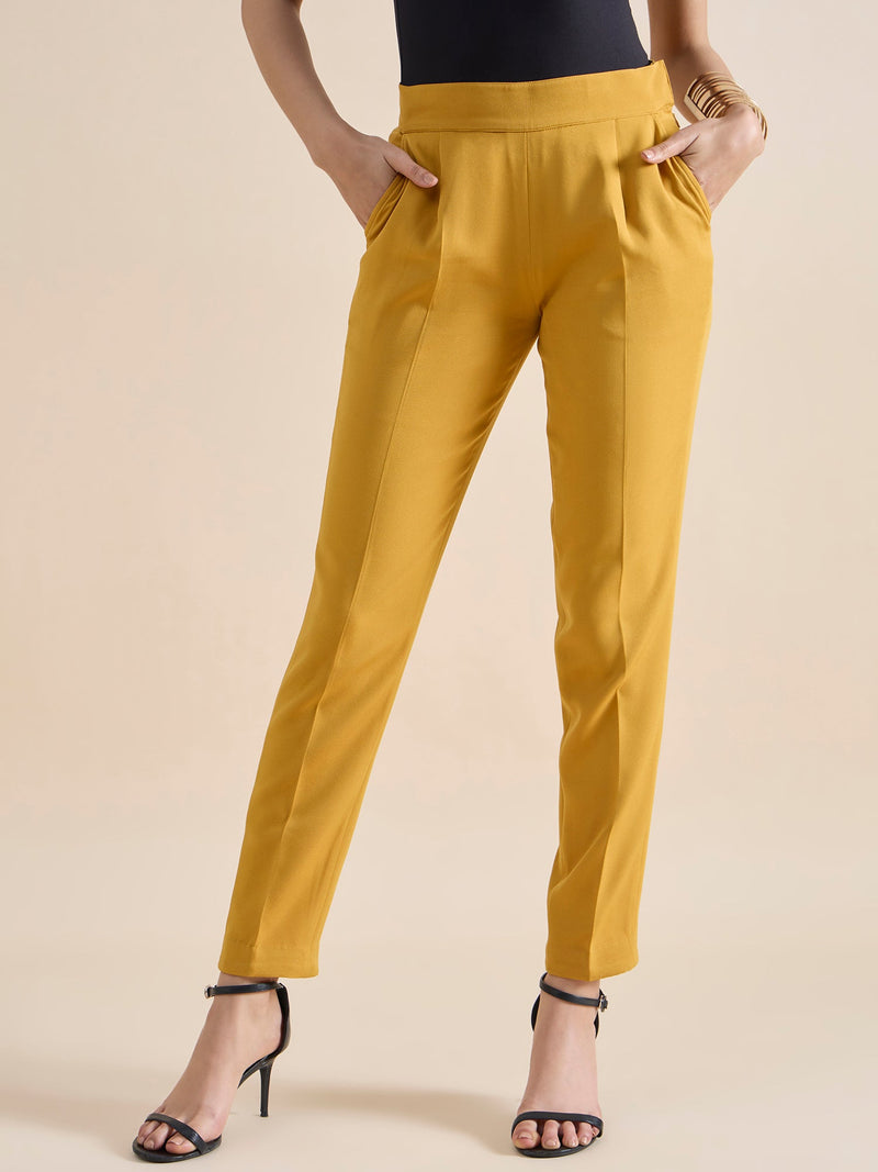 Women's slim fit stretch trousers in vibrant mustard yellow.