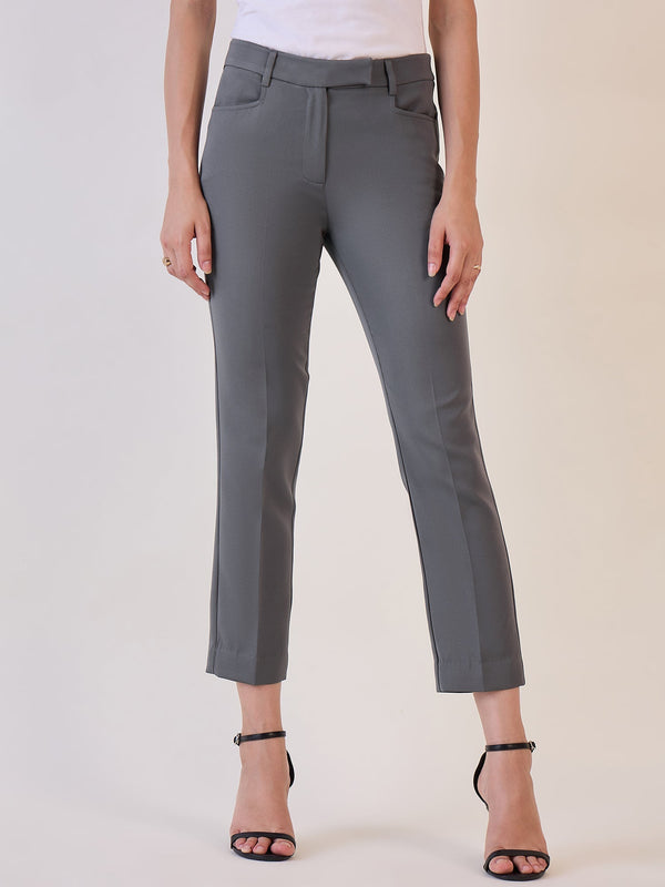 Grey slim fit mid waist trousers styled with black heels.